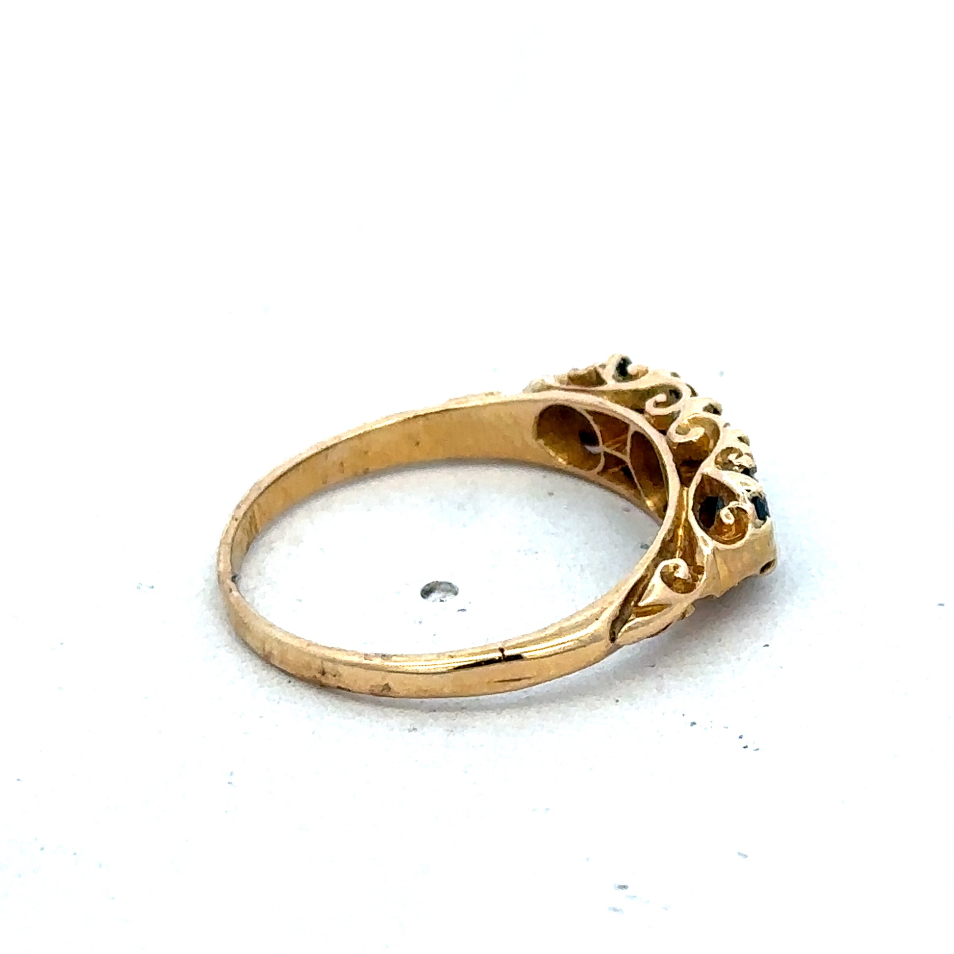 18ct yellow gold sapphire and diamond ring with a central sapphire and diamond accents, size O, by Reeves and Sons.