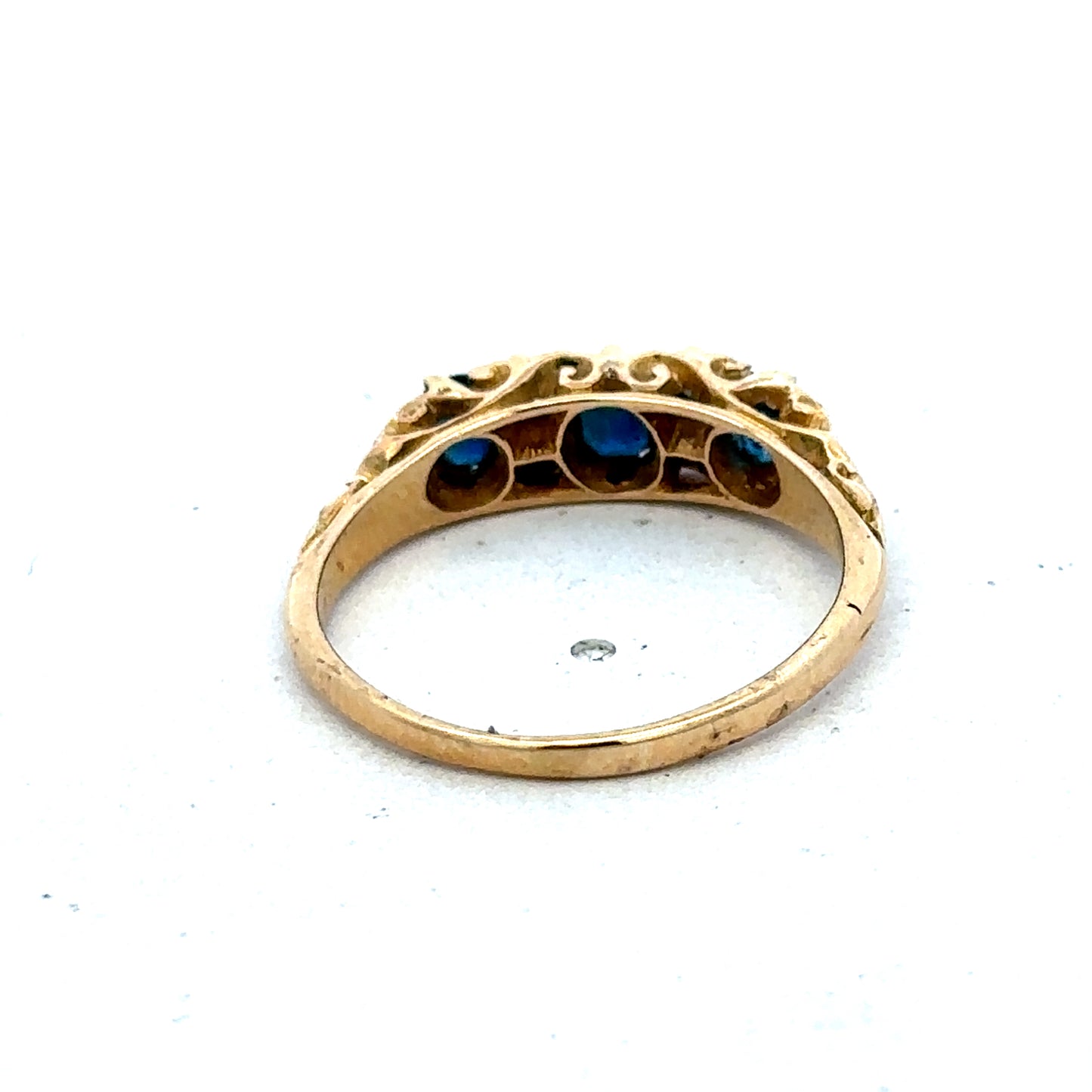 18ct yellow gold sapphire and diamond ring, size O, featuring a central sapphire gemstone with surrounding diamonds.