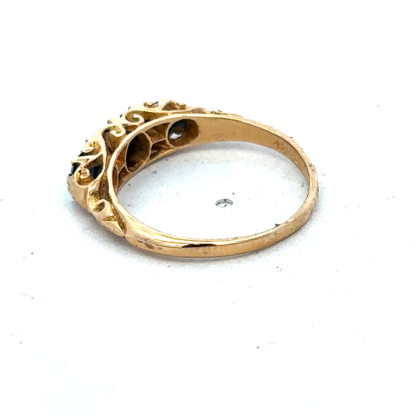 18ct yellow gold sapphire and diamond ring with intricate band design, size O, by Reeves and Sons.