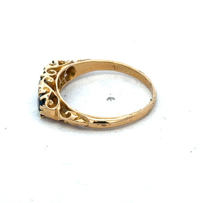 18ct yellow gold sapphire and diamond ring in size O with intricate design, crafted by Reeves and Sons.