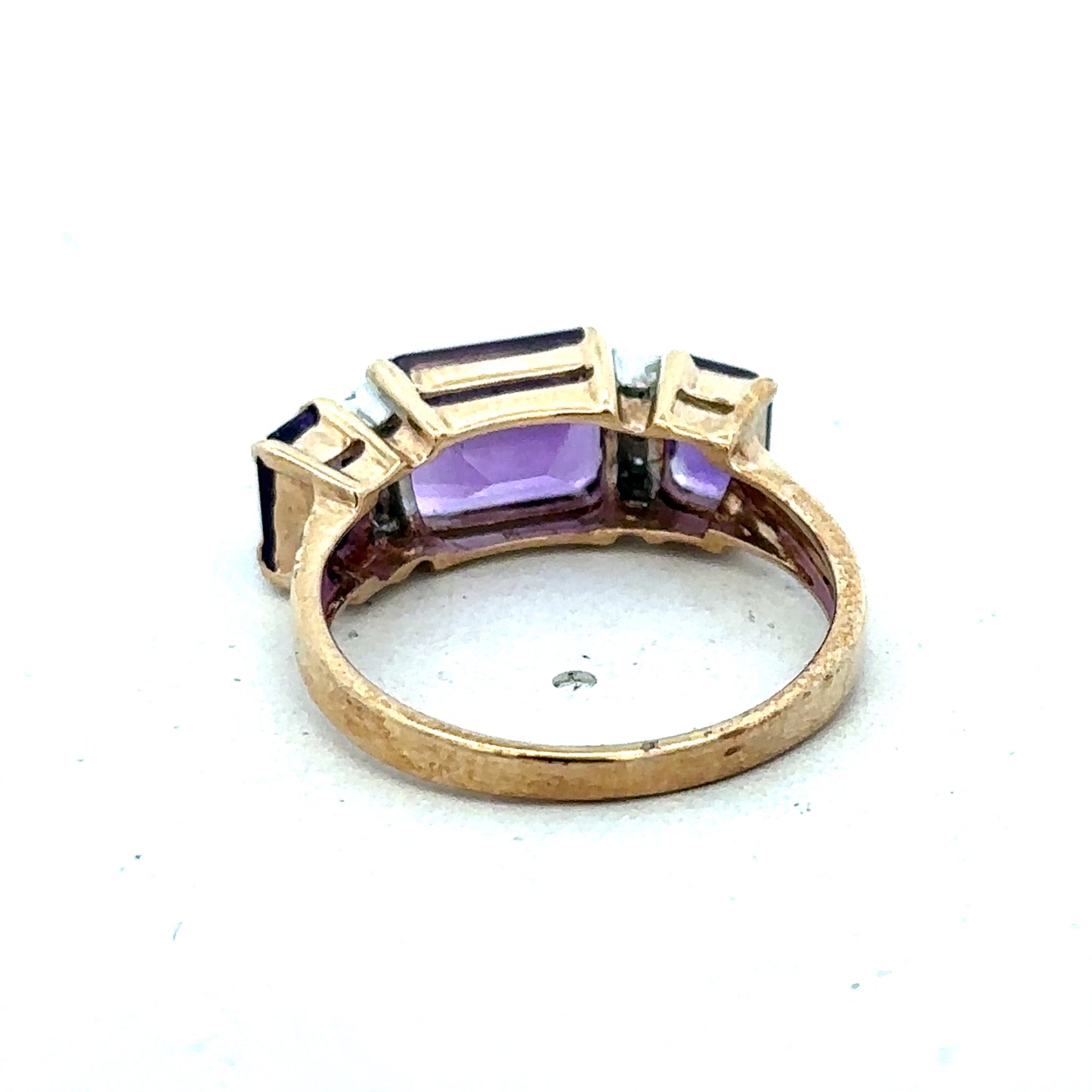 9ct yellow gold amethyst and diamond ring, size N, featuring a central purple gemstone with diamond accents, by Reeves and Sons.
