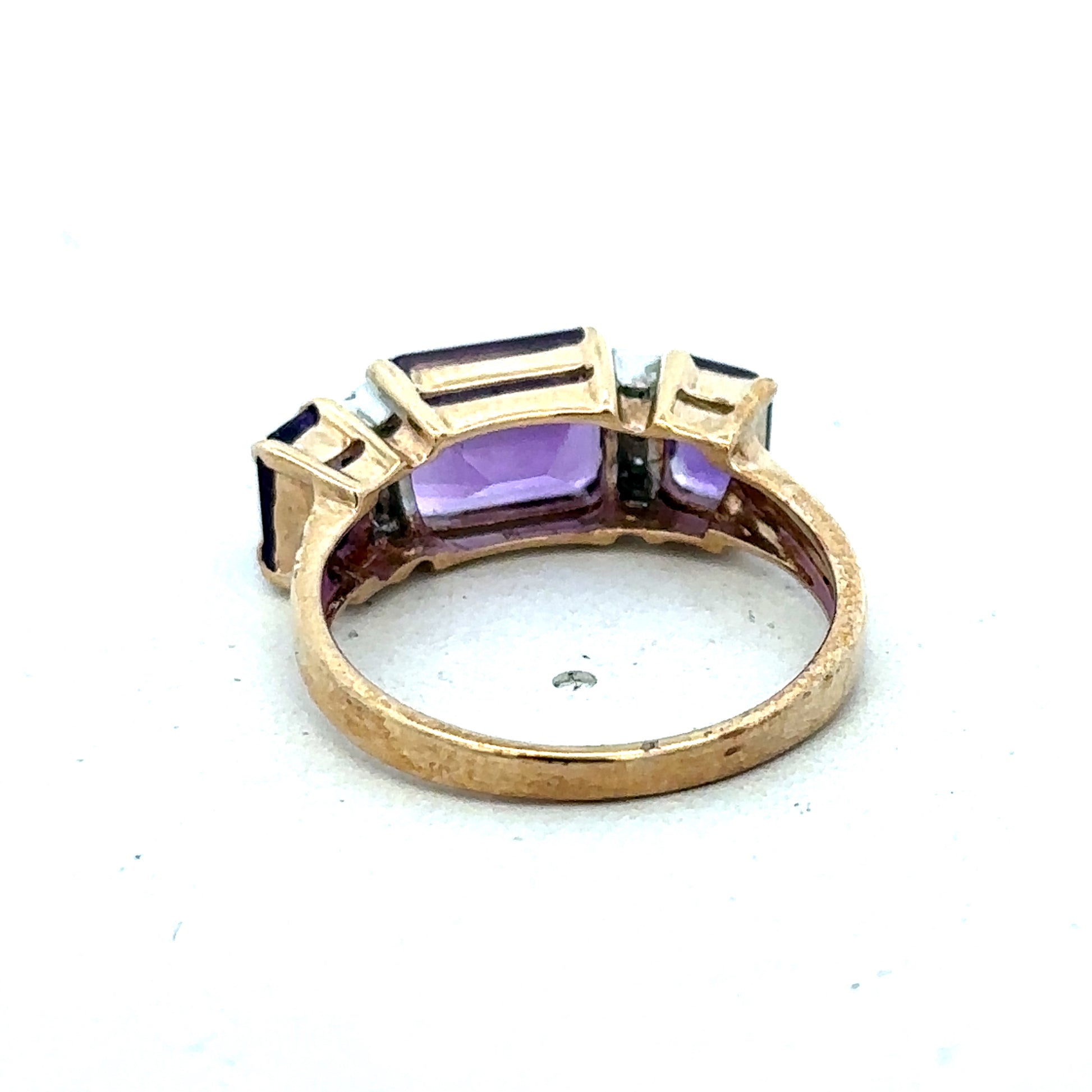9ct yellow gold amethyst and diamond ring, size N, featuring a central purple gemstone with diamond accents, by Reeves and Sons.