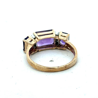 9ct yellow gold amethyst and diamond ring, size N, featuring a central purple gemstone with diamond accents, by Reeves and Sons.