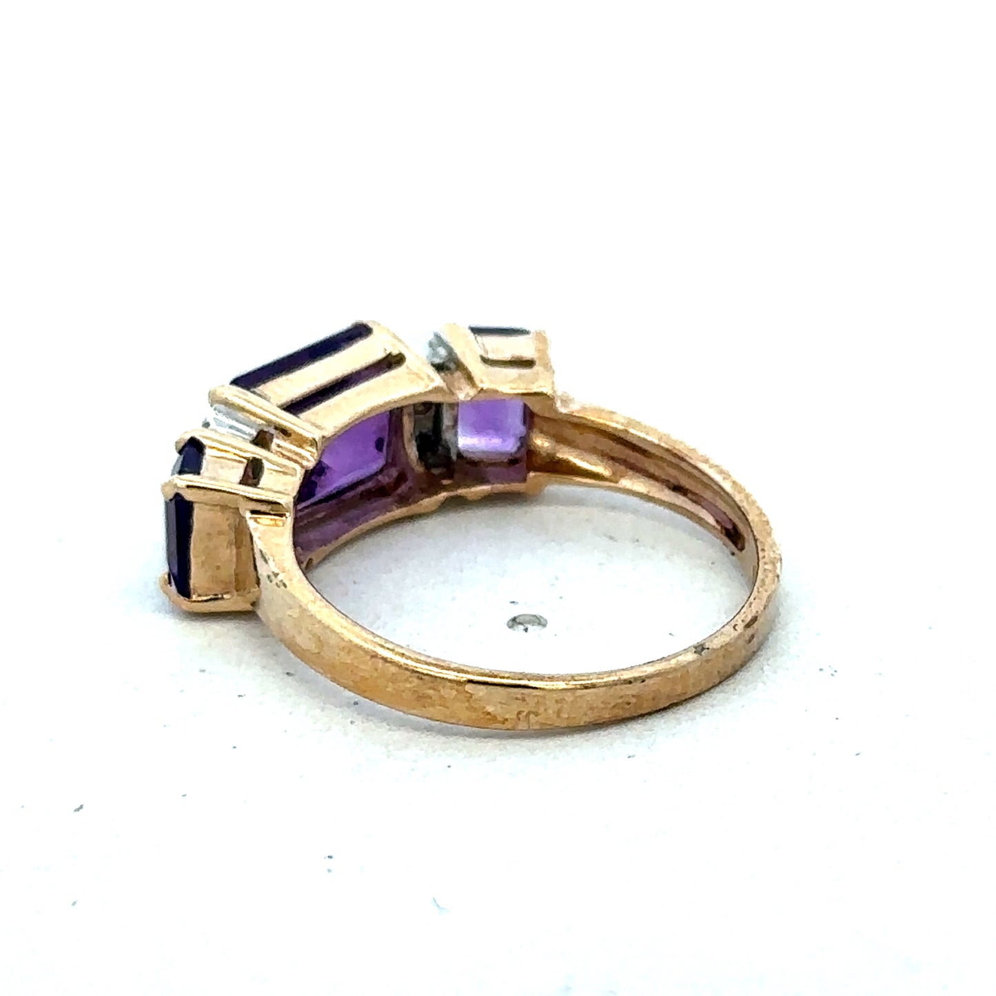 9ct yellow gold amethyst and diamond ring in size N, featuring a central purple amethyst gemstone with diamond accents.