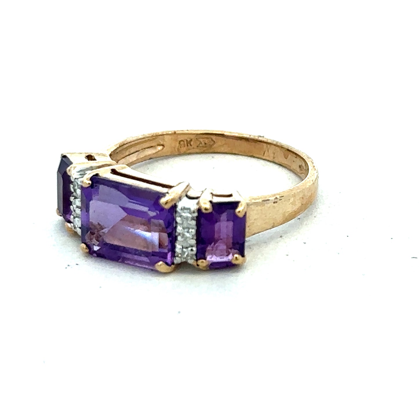 9ct yellow gold amethyst and diamond ring in size N, featuring a central purple gemstone and sparkling accents, by Reeves and Sons