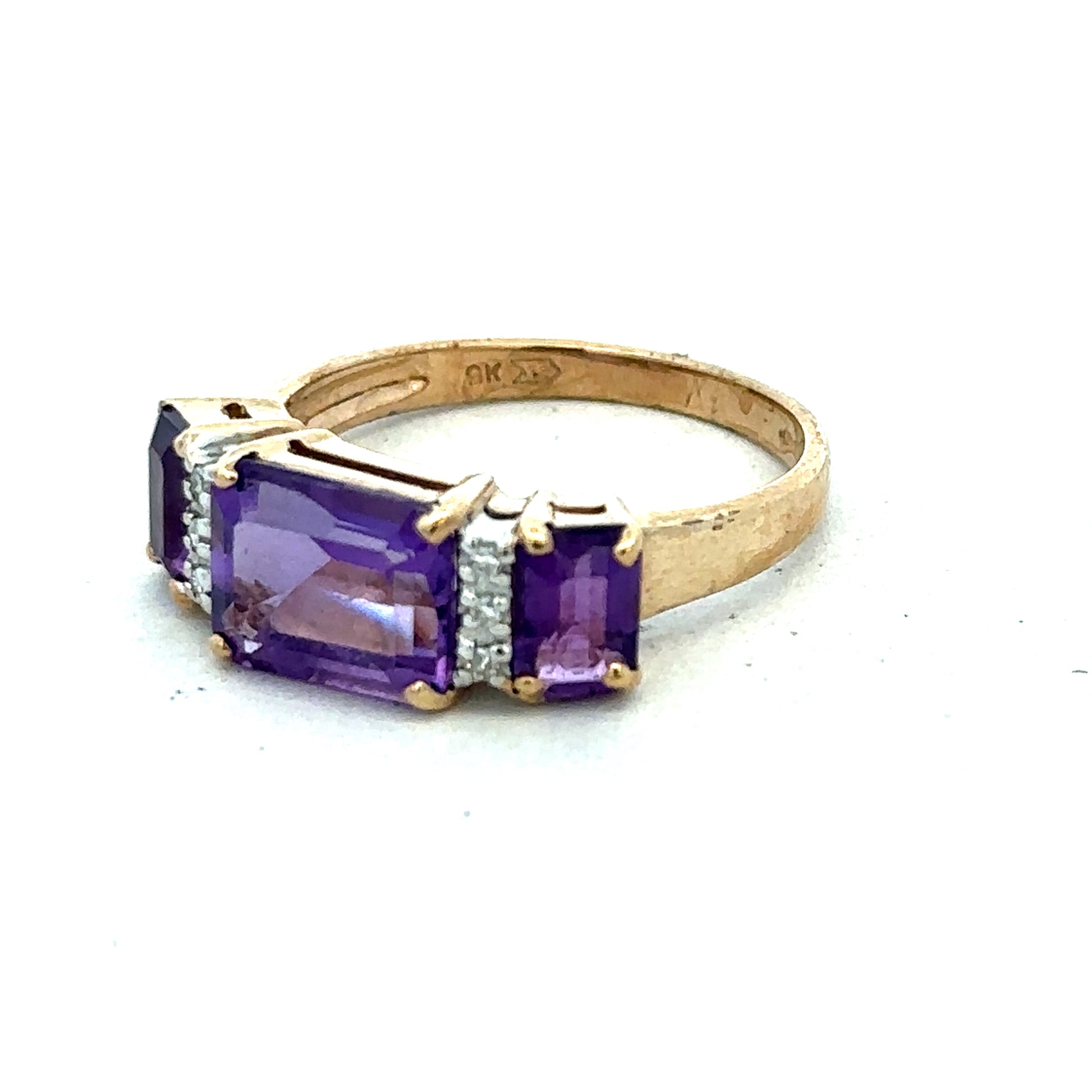 9ct yellow gold amethyst and diamond ring in size N, featuring a central purple gemstone and sparkling accents, by Reeves and Sons