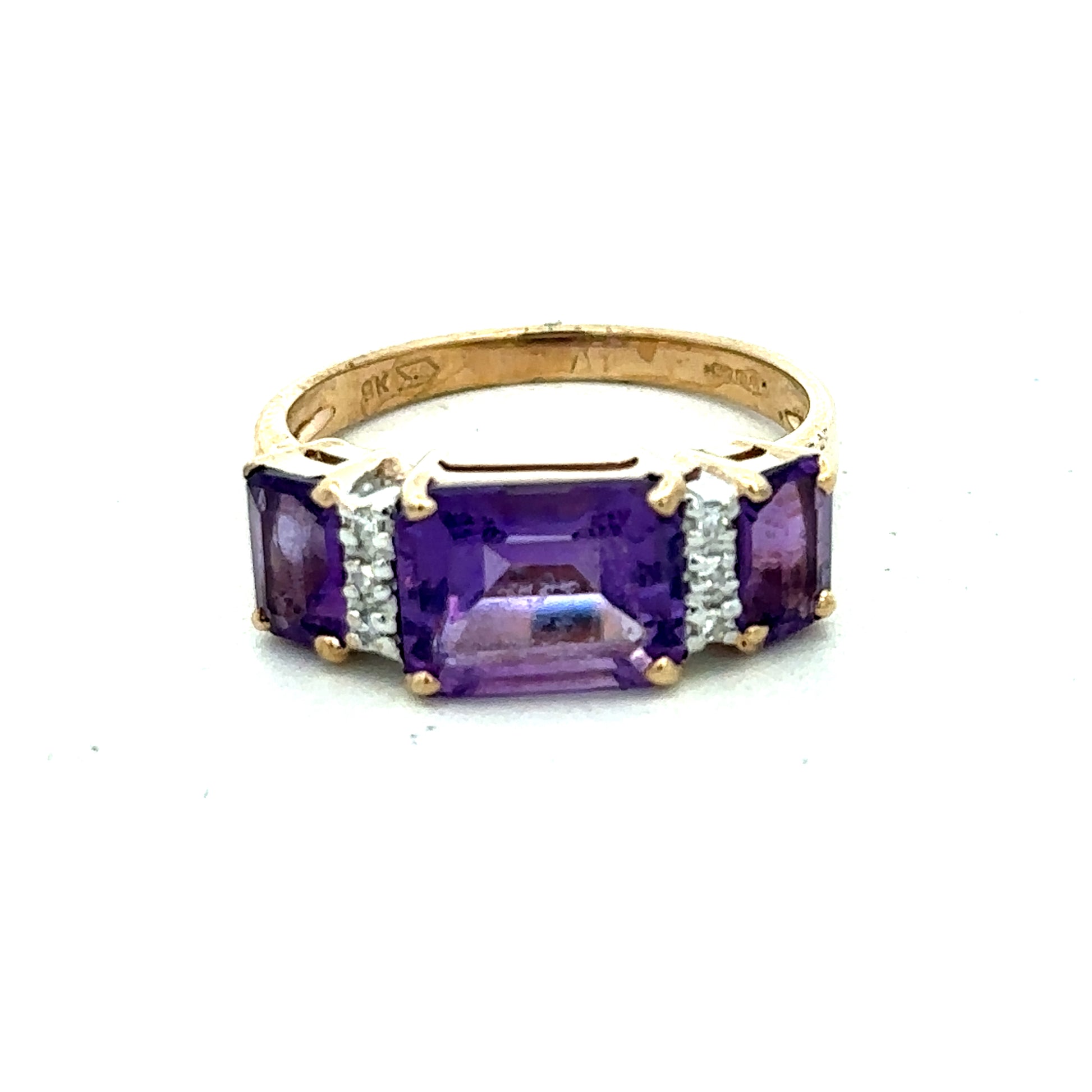 9ct yellow gold amethyst and diamond ring in size N with intricate band design, showcasing a vibrant purple gemstone and sparkling diamonds.