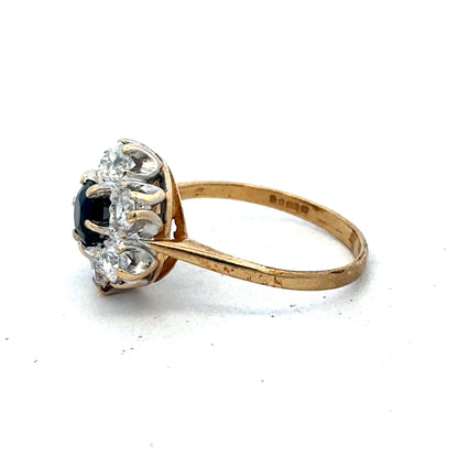 9ct yellow gold ring in size O by Reeves and Sons, featuring a simple band design, shown in a close-up image.