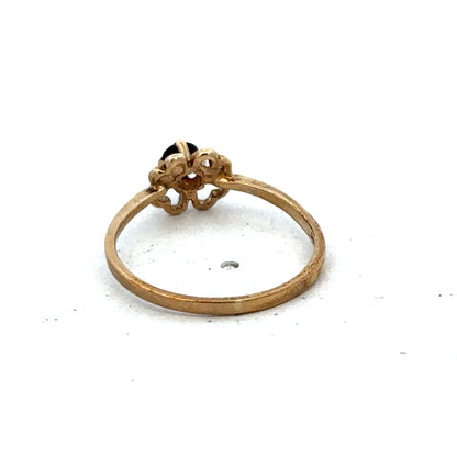 9ct yellow gold ring size M by Reeves and Sons, showcasing a polished band with a smooth finish.