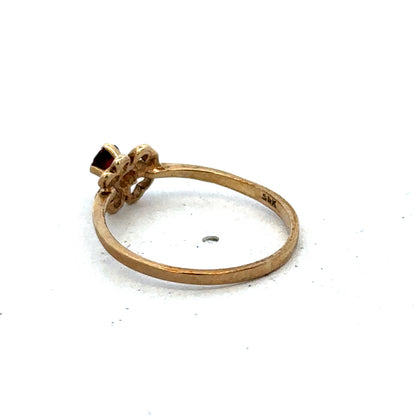 Yellow gold ring in size M with a simple band design, crafted by Reeves and Sons.