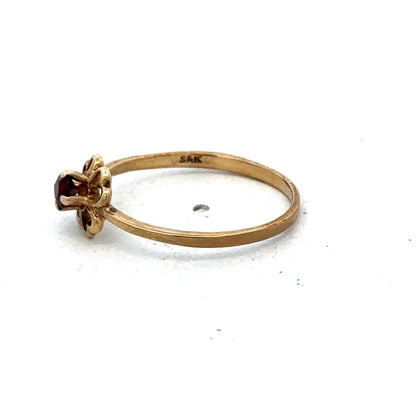 9ct yellow gold ring in size M with a smooth band, crafted by Reeves and Sons, displayed against a neutral background.