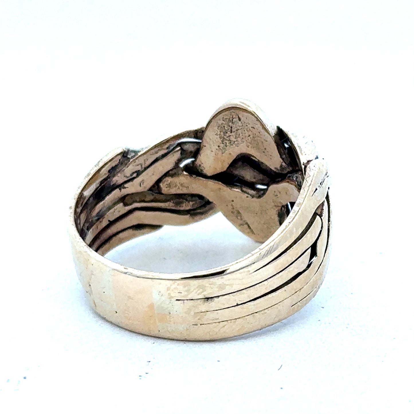 9ct yellow gold puzzle ring in size U with intricate design, showcasing Reeves and Sons craftsmanship.