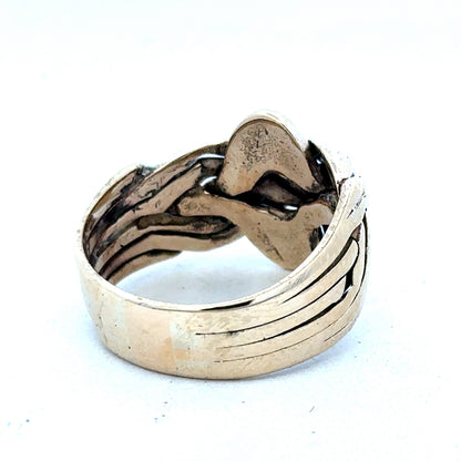 9ct yellow gold puzzle ring in size U with intricate design, showcasing Reeves and Sons craftsmanship.