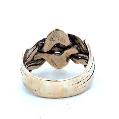 9ct yellow gold puzzle ring in size U with intricate design, crafted by Reeves and Sons.