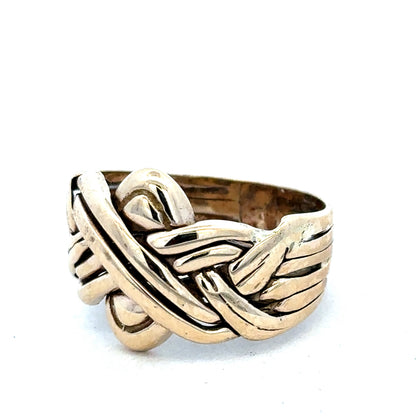9ct yellow gold puzzle ring in size U by Reeves and Sons, featuring interlocking band design with a polished finish.