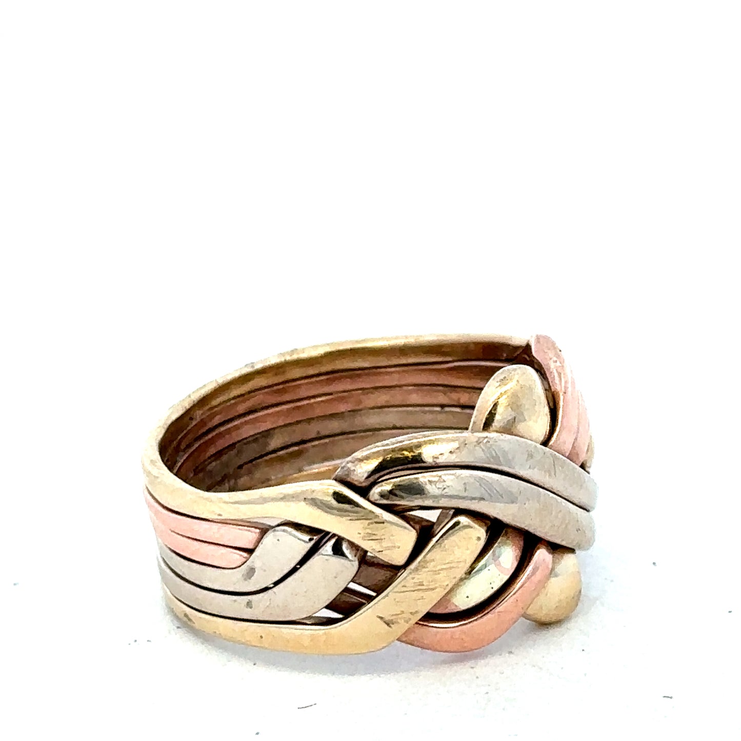 9ct yellow gold puzzle ring in size U1/2 with intricate design, crafted by Reeves and Sons, shown in close-up.