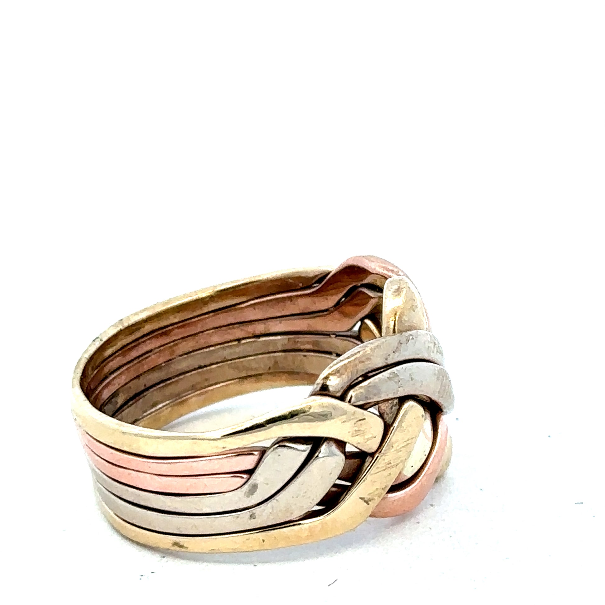 9ct yellow gold puzzle ring in size U1/2 with intricate design, crafted by Reeves and Sons, displayed on a neutral background.