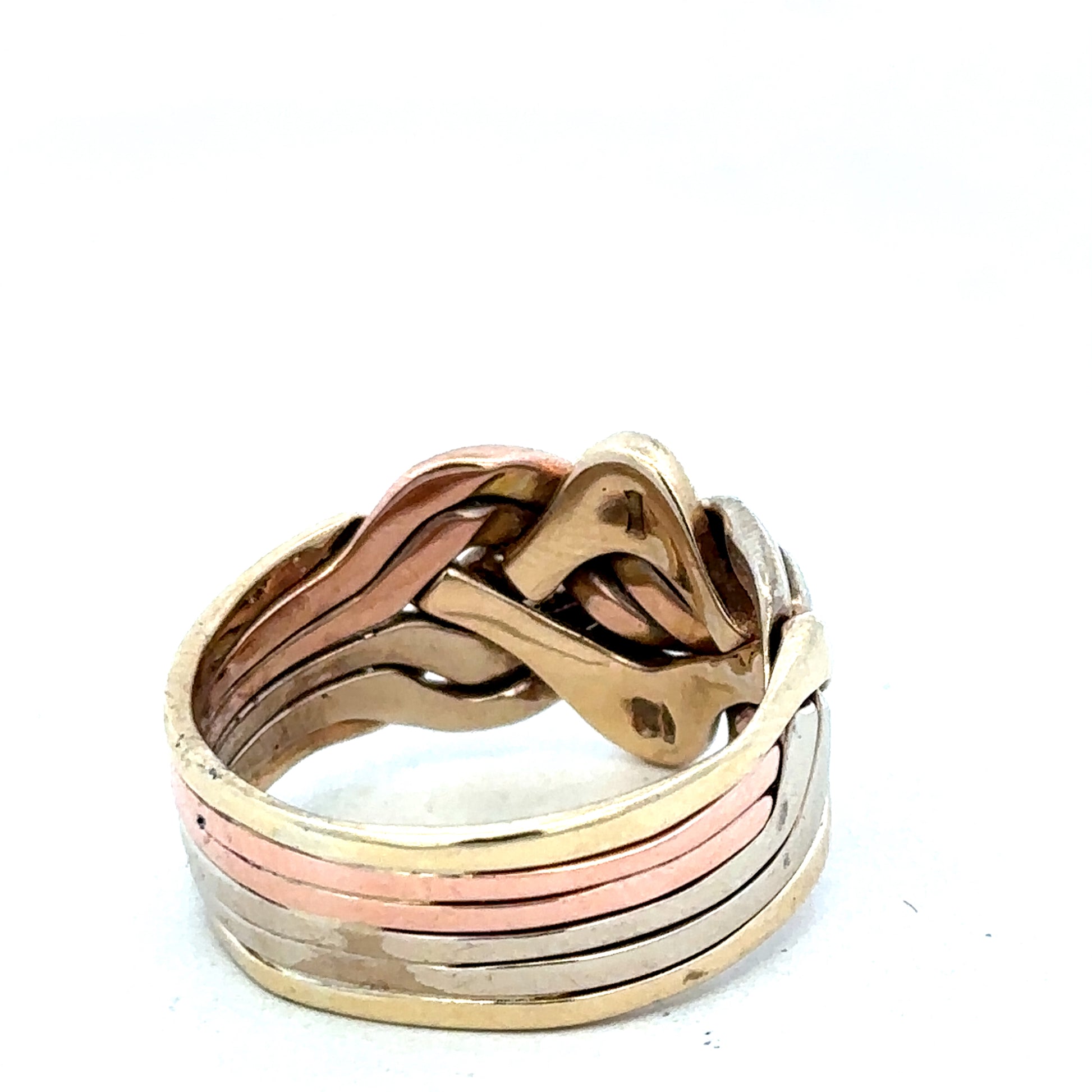 9ct yellow gold puzzle ring in size U1/2 with interlocking designs, crafted by Reeves and Sons.