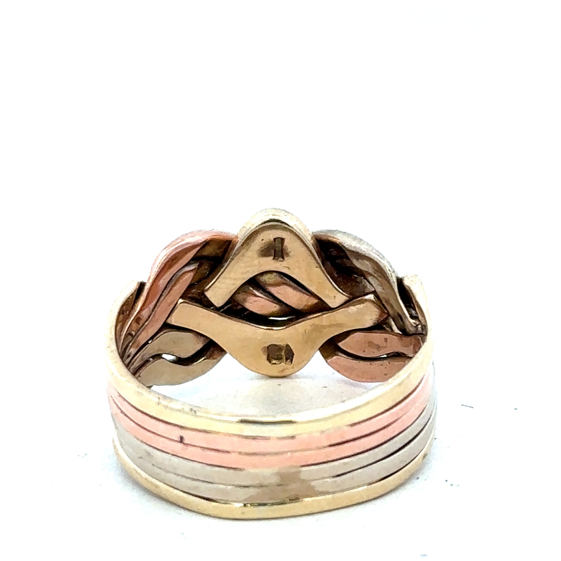 9ct yellow gold puzzle ring in size U1/2 with intricate design, crafted by Reeves and Sons, displayed on a neutral background.