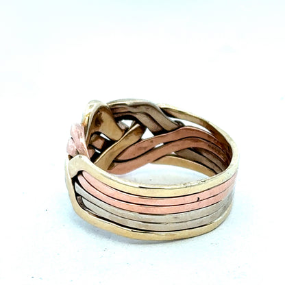 9ct yellow gold puzzle ring in size U1/2 with interlocking band design, crafted by Reeves and Sons.