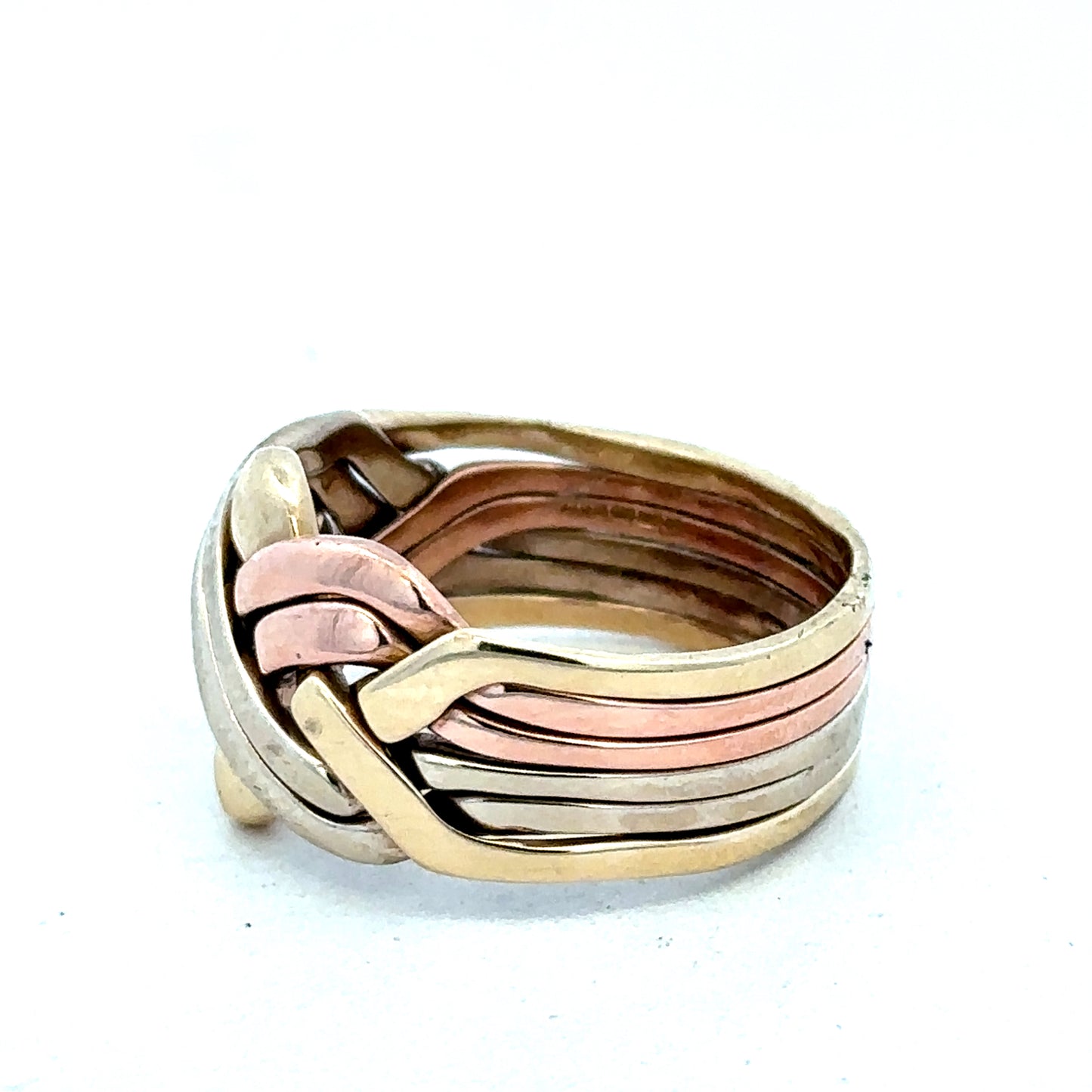 9ct yellow gold puzzle ring in size U1/2 with intricate design, crafted by Reeves and Sons.
