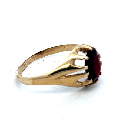 9ct yellow gold ring in size V with a smooth band, crafted by Reeves and Sons.