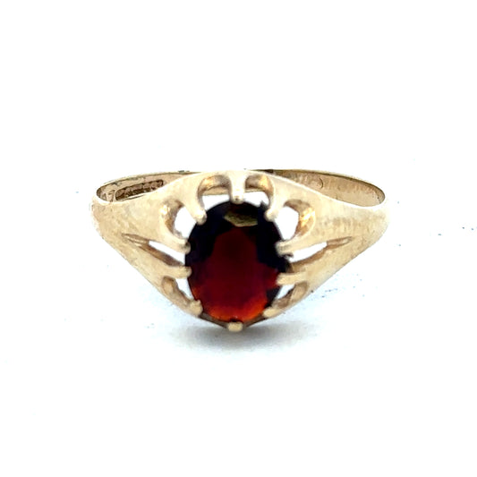 9ct yellow gold ring in size V with a smooth band, crafted by Reeves and Sons, displayed on a neutral background.