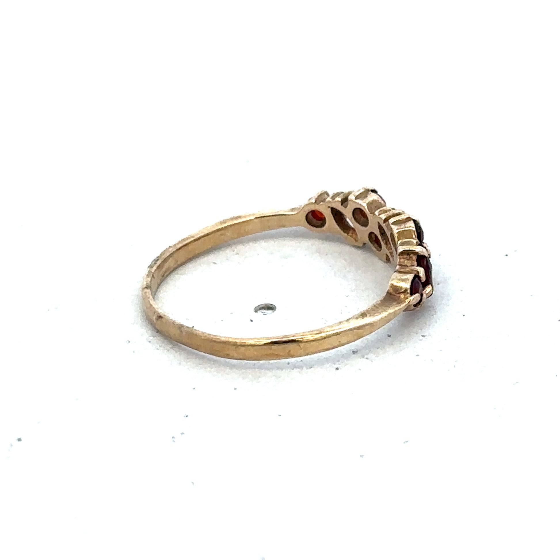9ct yellow gold ring size N with a smooth band from Reeves and Sons, shown in close-up detail.