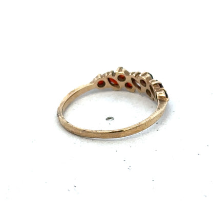 9ct yellow gold ring size N by Reeves and Sons, showcasing a polished band with a smooth finish.
