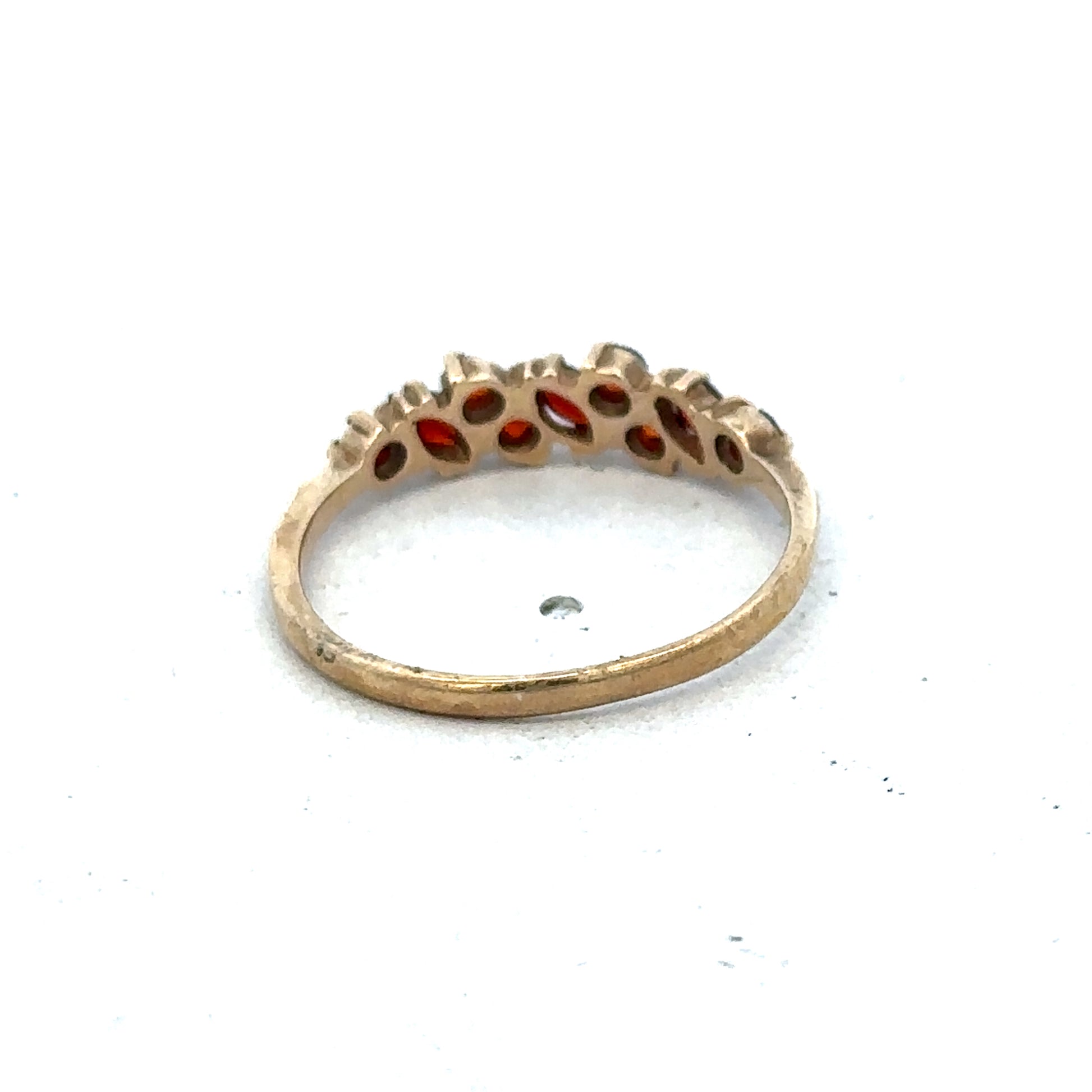 9ct yellow gold ring size N by Reeves and Sons, featuring a smooth polished band, shown close-up.