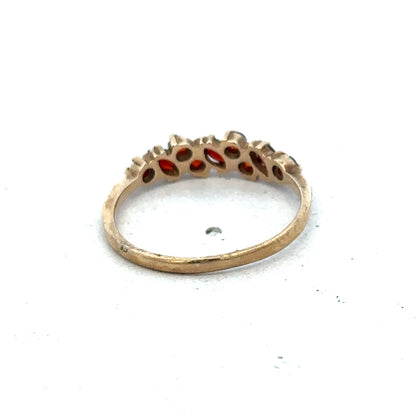 9ct yellow gold ring size N by Reeves and Sons, featuring a smooth polished band, shown close-up.