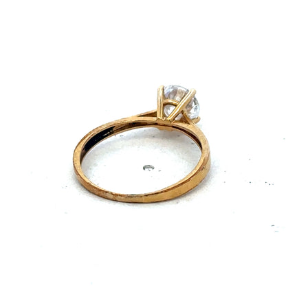 9ct yellow gold ring size L from Reeves and Sons, showcasing a polished band with a smooth, shiny finish.