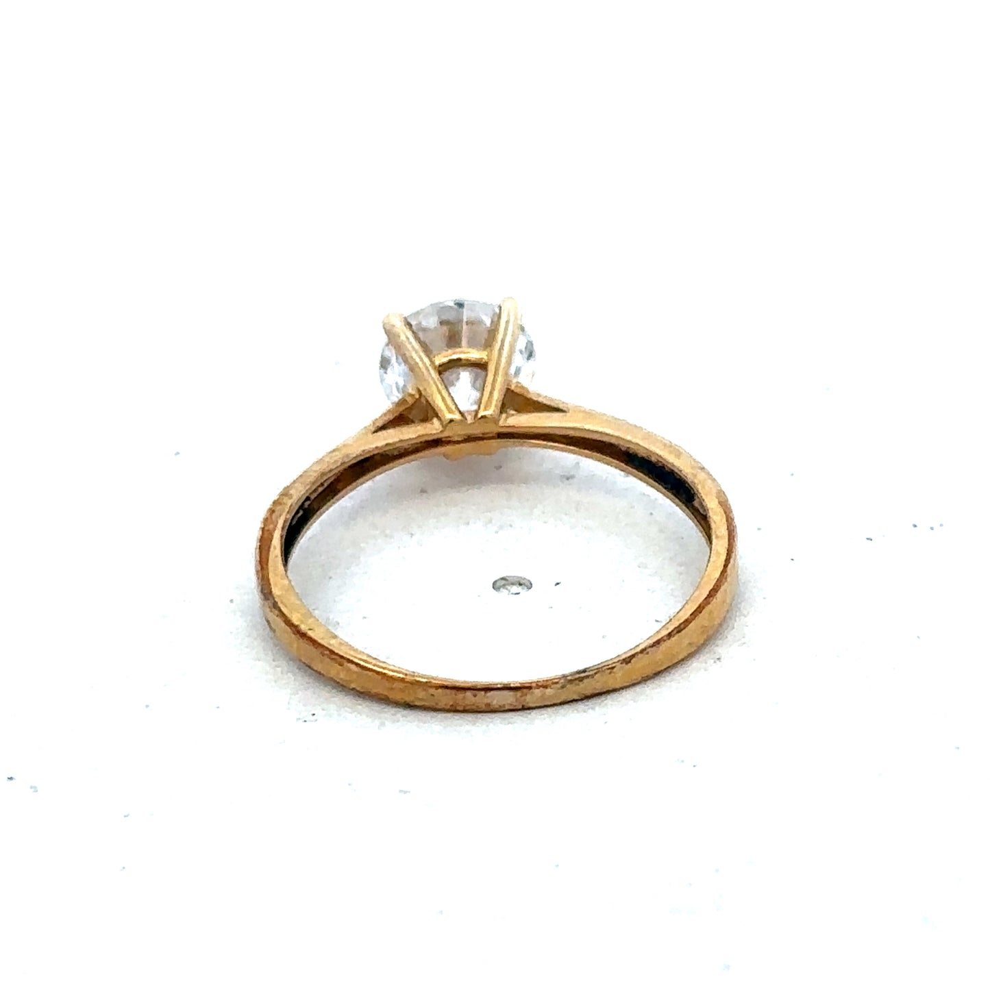 9ct yellow gold ring in size L by Reeves and Sons, featuring a smooth polished band visible in the image.