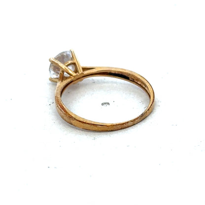 9ct yellow gold ring in size L by Reeves and Sons, featuring a smooth polished band and elegant design.