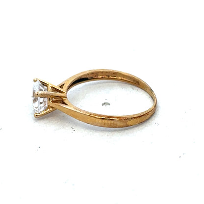 9ct yellow gold ring size L by Reeves and Sons, close-up showing polished band and classic design.
