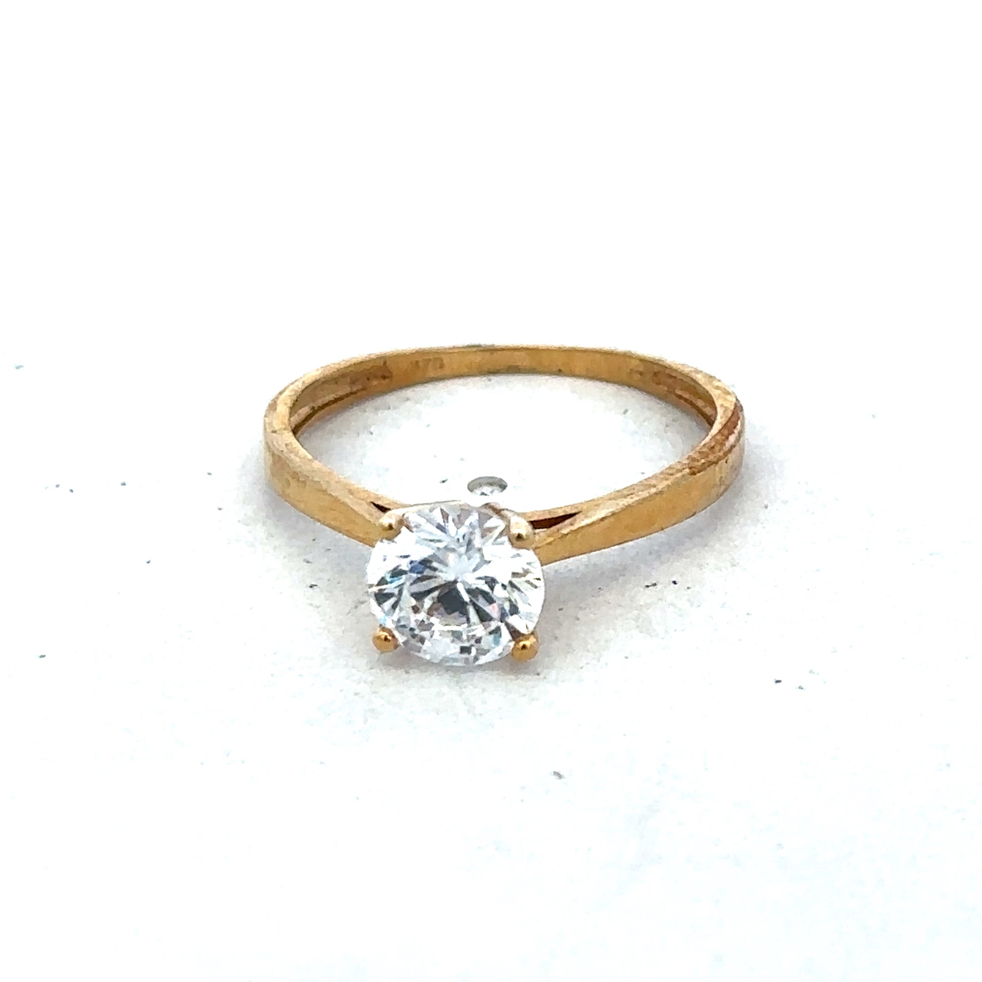 9ct yellow gold ring in size L with a smooth polished band, crafted by Reeves and Sons.