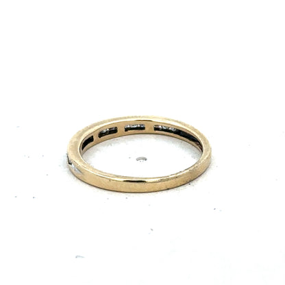 9ct yellow gold diamond half eternity ring in size N with sparkling stones, crafted by Reeves and Sons.
