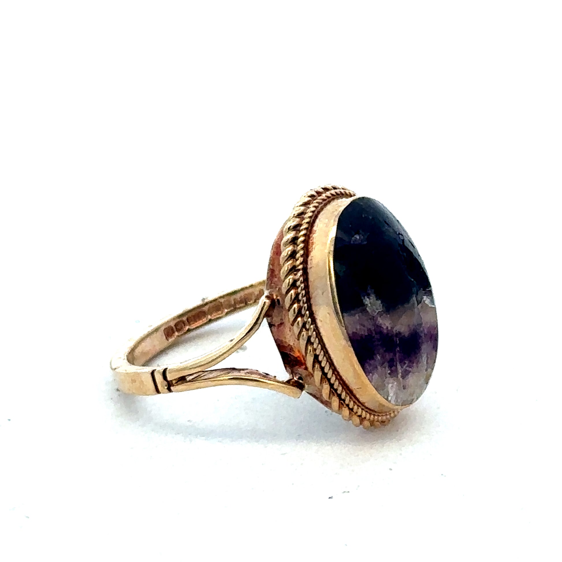 9ct yellow gold ring size L by Reeves and Sons, close-up of polished band showing smooth finish and classic design.