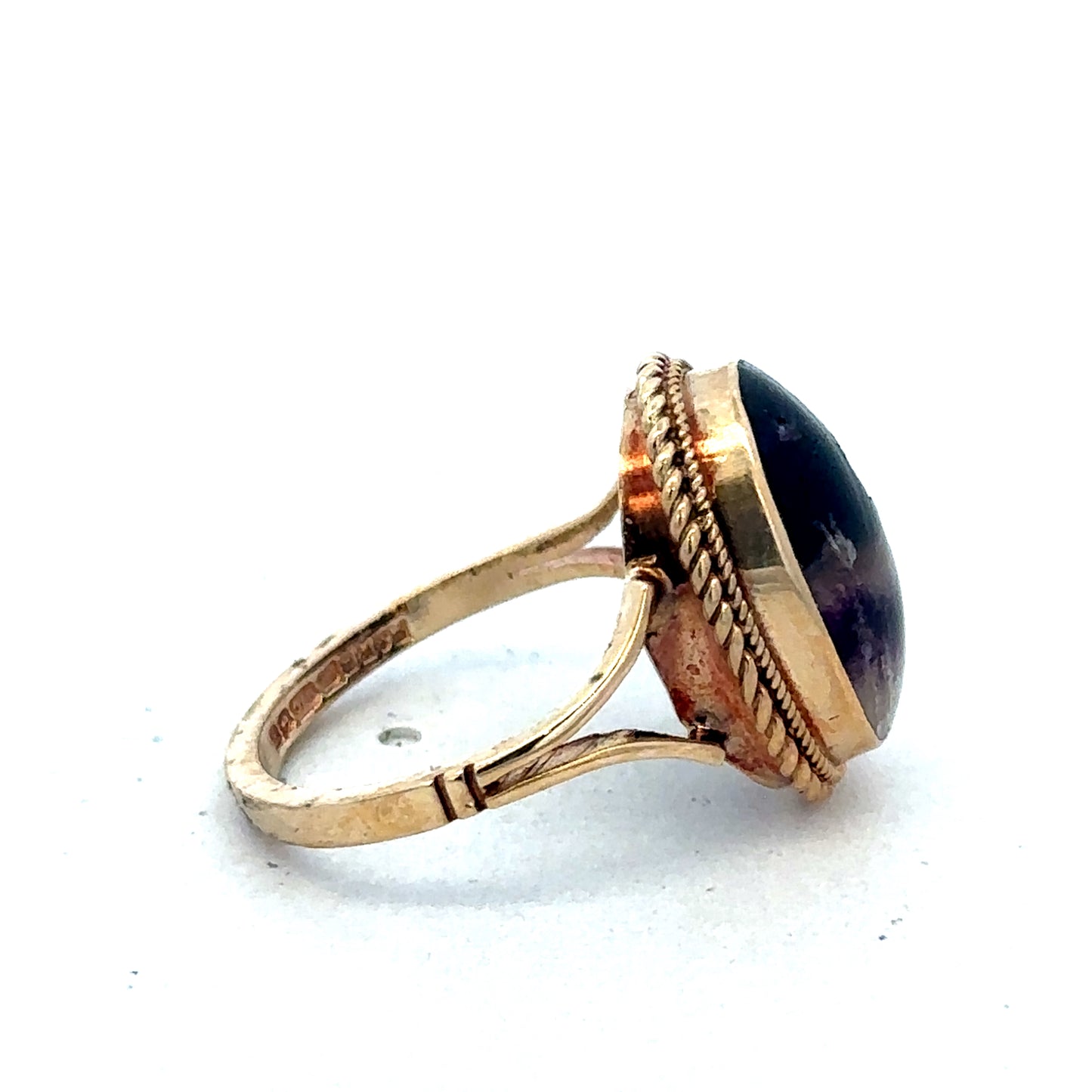 9ct yellow gold ring size L from Reeves and Sons, close-up view showing smooth band and polished finish.