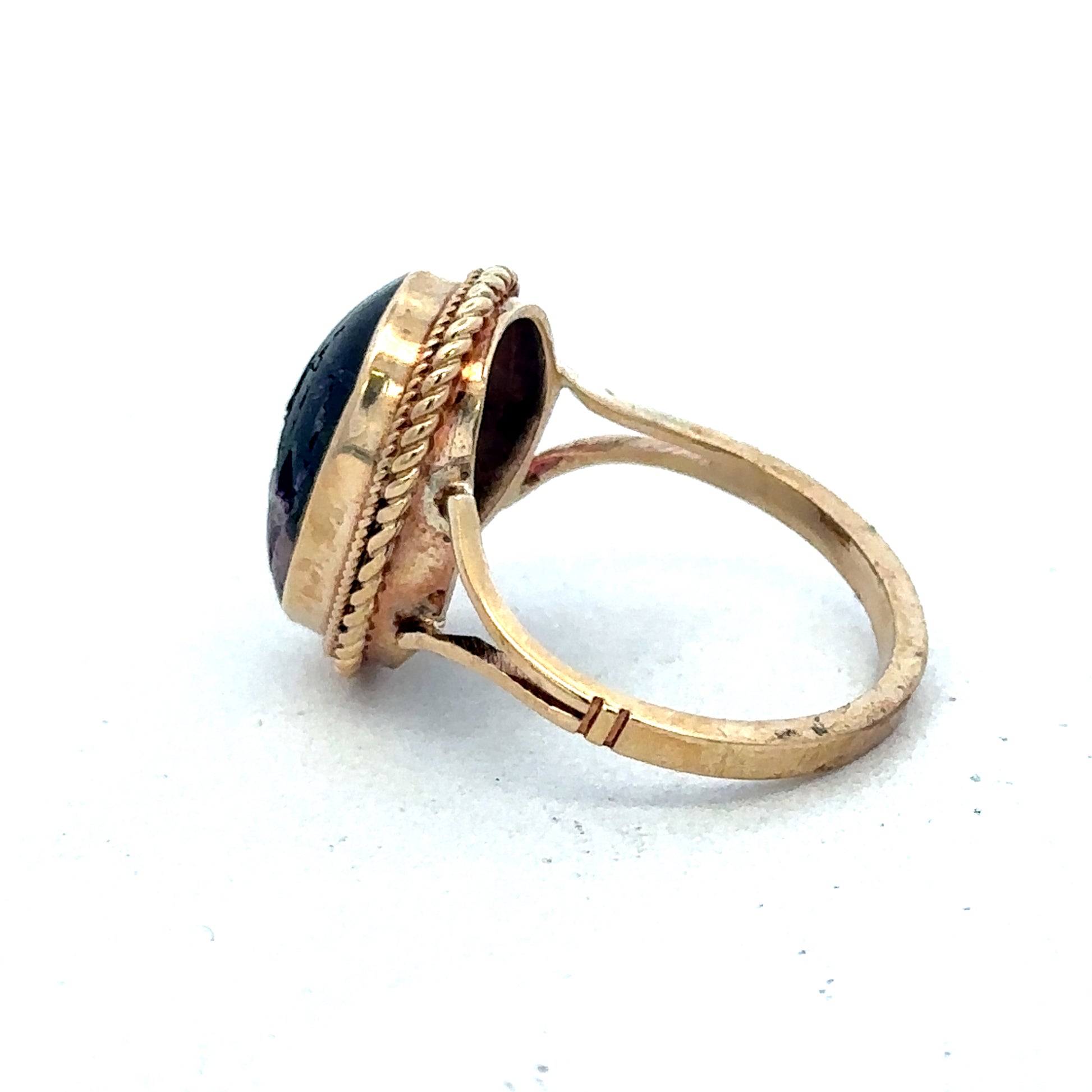 9ct yellow gold ring size L by Reeves and Sons, showcasing a polished band with a smooth finish.