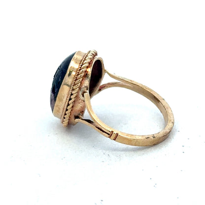 9ct yellow gold ring size L by Reeves and Sons, showcasing a polished band with a smooth finish.