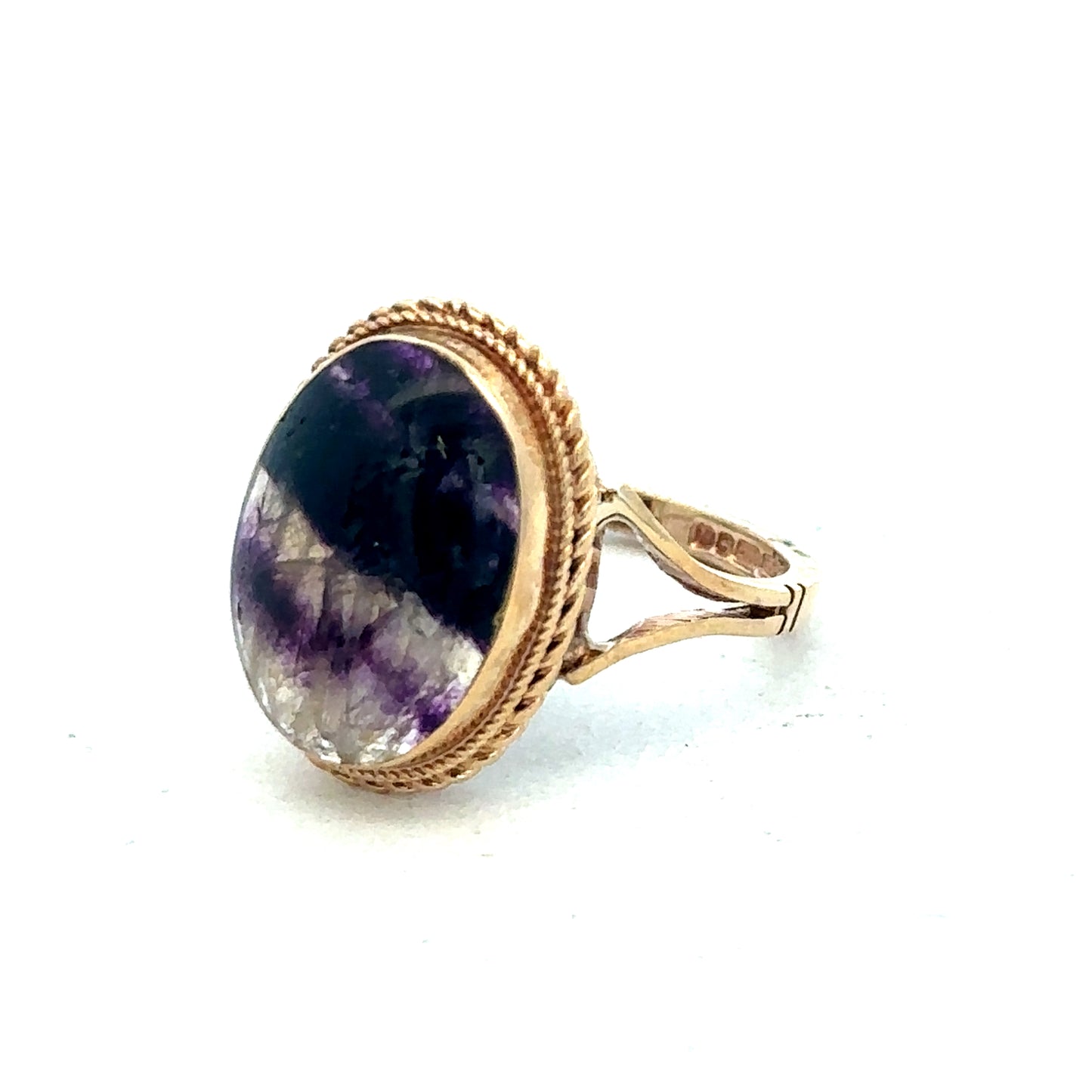 9ct yellow gold ring in size L by Reeves and Sons, close-up displaying smooth band and polished finish.