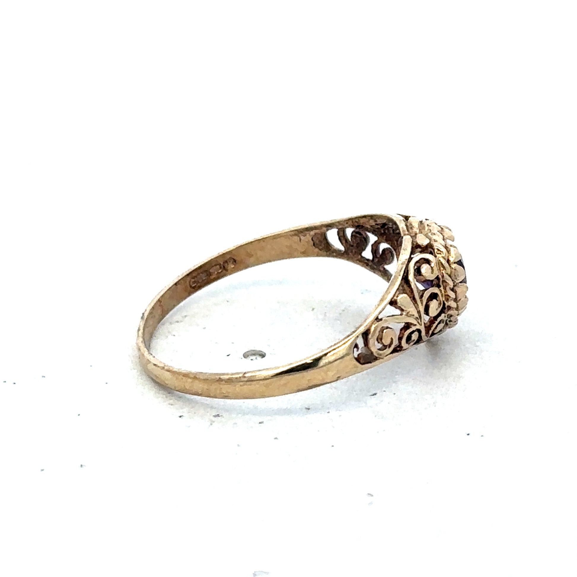 9ct yellow gold ring in size Q from Reeves and Sons, featuring a smooth polished band and elegant design.