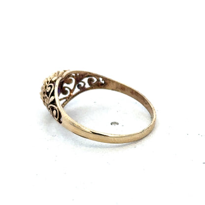9ct yellow gold ring size Q by Reeves and Sons, close-up view showing smooth polished surface and elegant design.