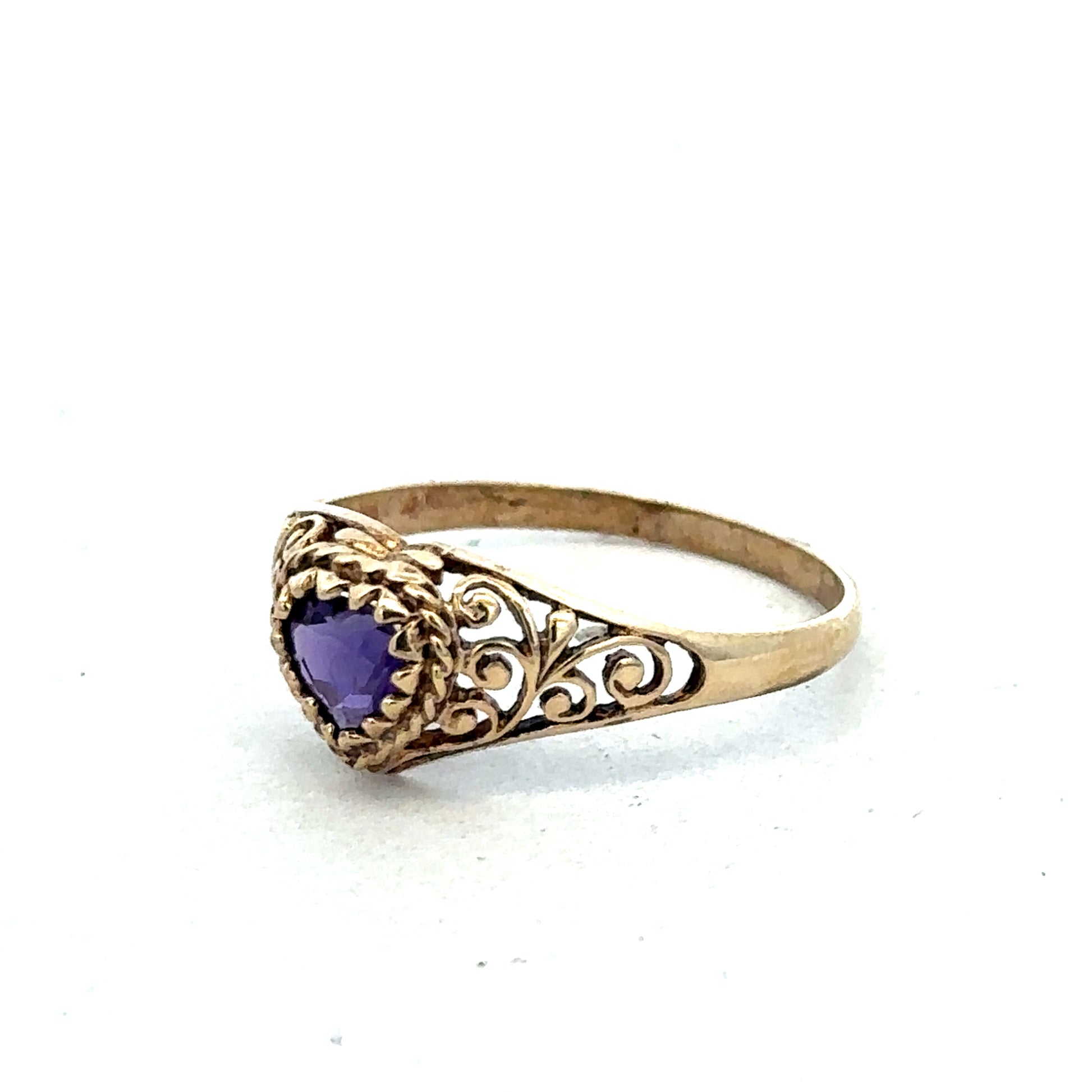 9ct yellow gold ring size Q by Reeves and Sons, showcasing a smooth polished band on a white background.