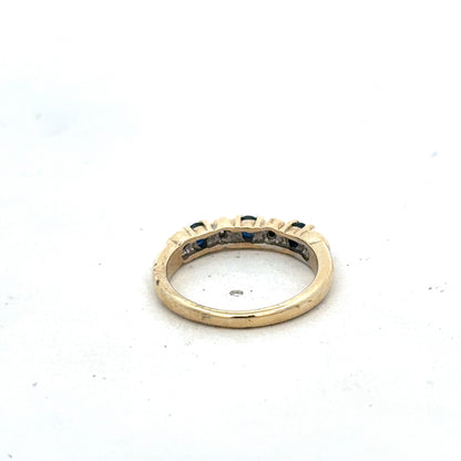 9ct yellow gold sapphire and diamond ring in size M 1/2 with Reeves and Sons branding, featuring a central sapphire and diamond accents.