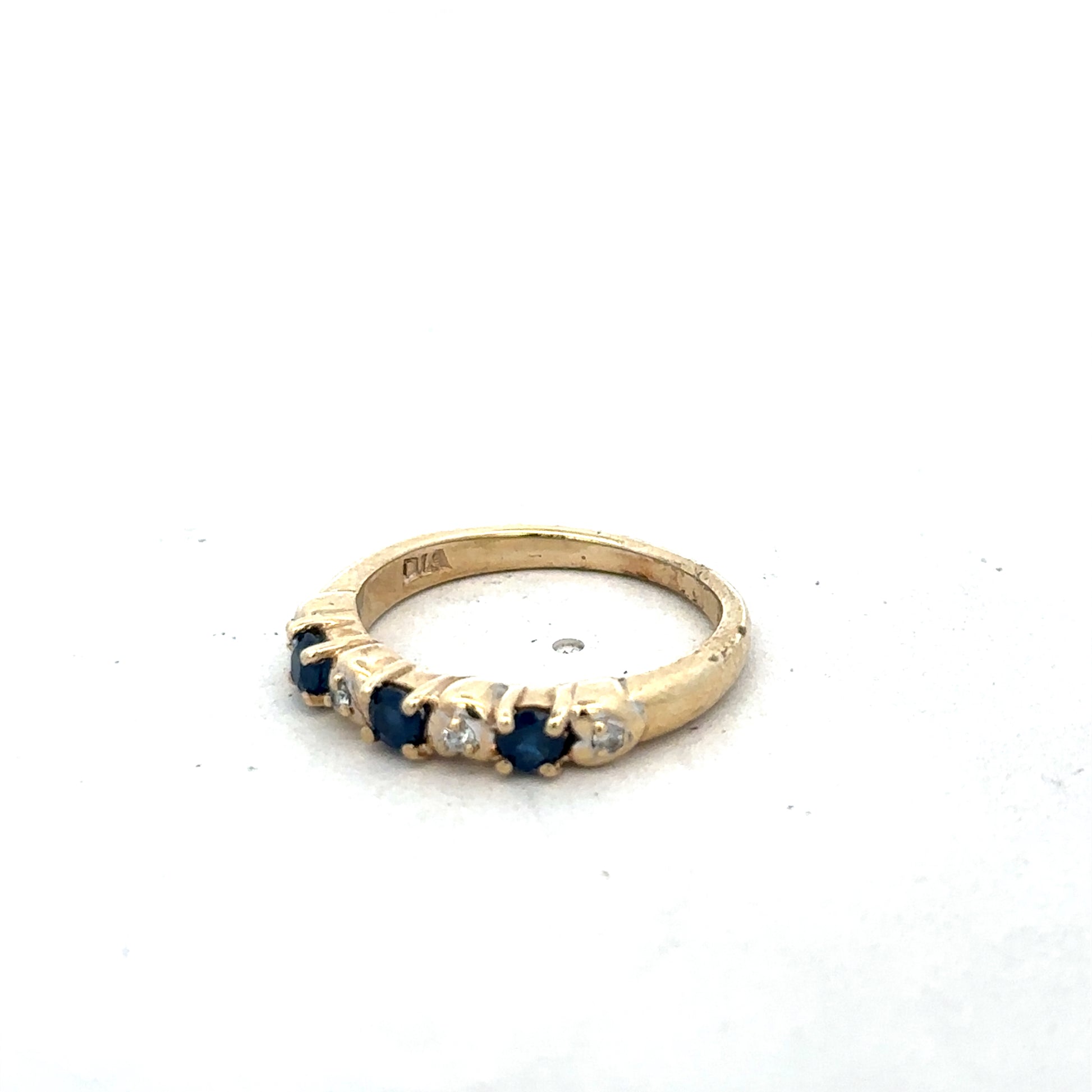 9ct yellow gold sapphire and diamond ring in size M 1/2, featuring a sleek band with sparkling gemstones, by Reeves and Sons.