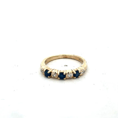 9ct yellow gold sapphire and diamond ring in size M 1/2, featuring a sleek design with sparkling gemstones.