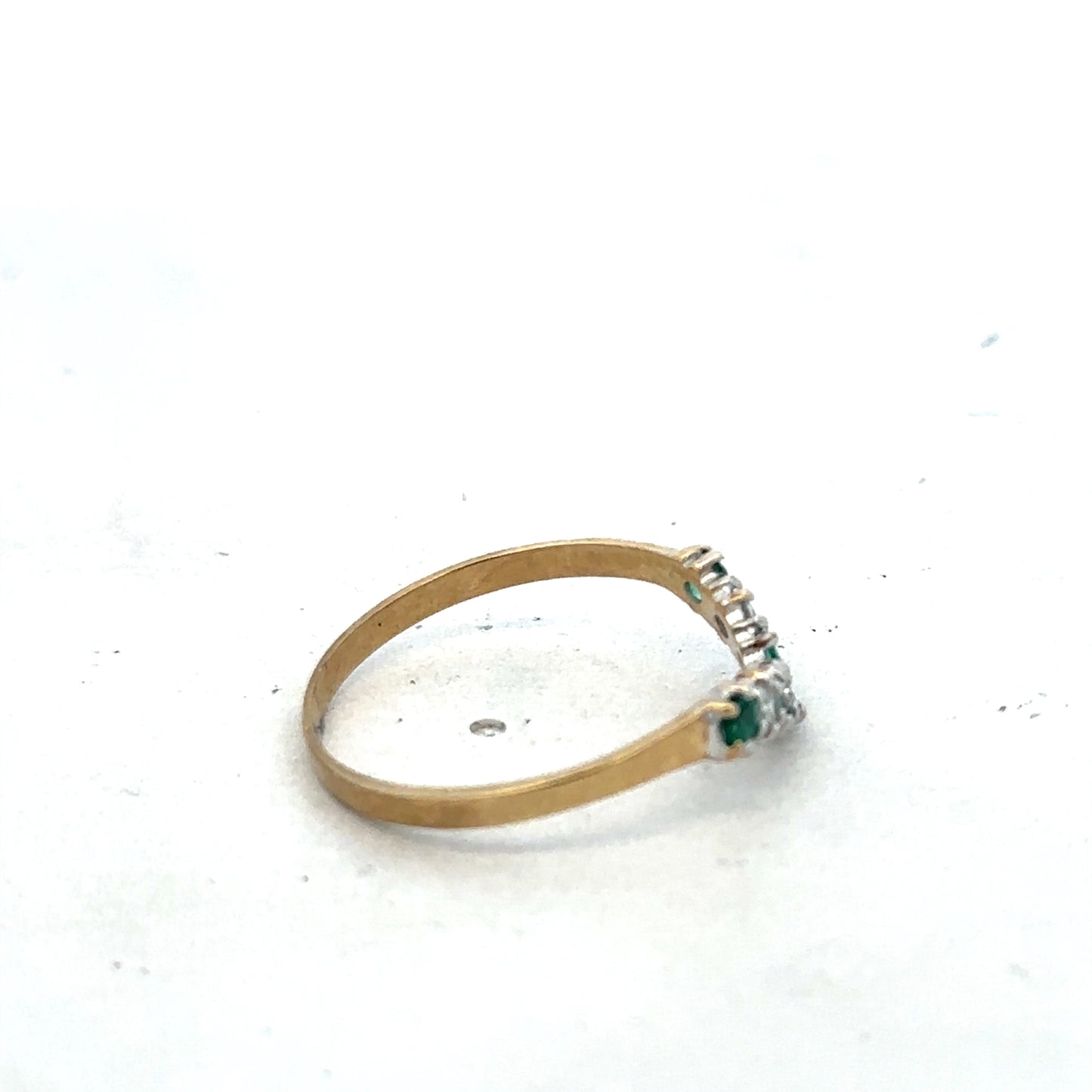 9ct yellow gold emerald and diamond ring with intricate band design, size O½, by Reeves and Sons.