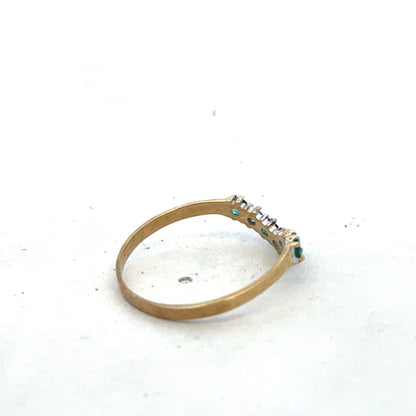9ct yellow gold emerald and diamond ring with intricate band design, size O1/2, by Reeves and Sons, shown in close-up.